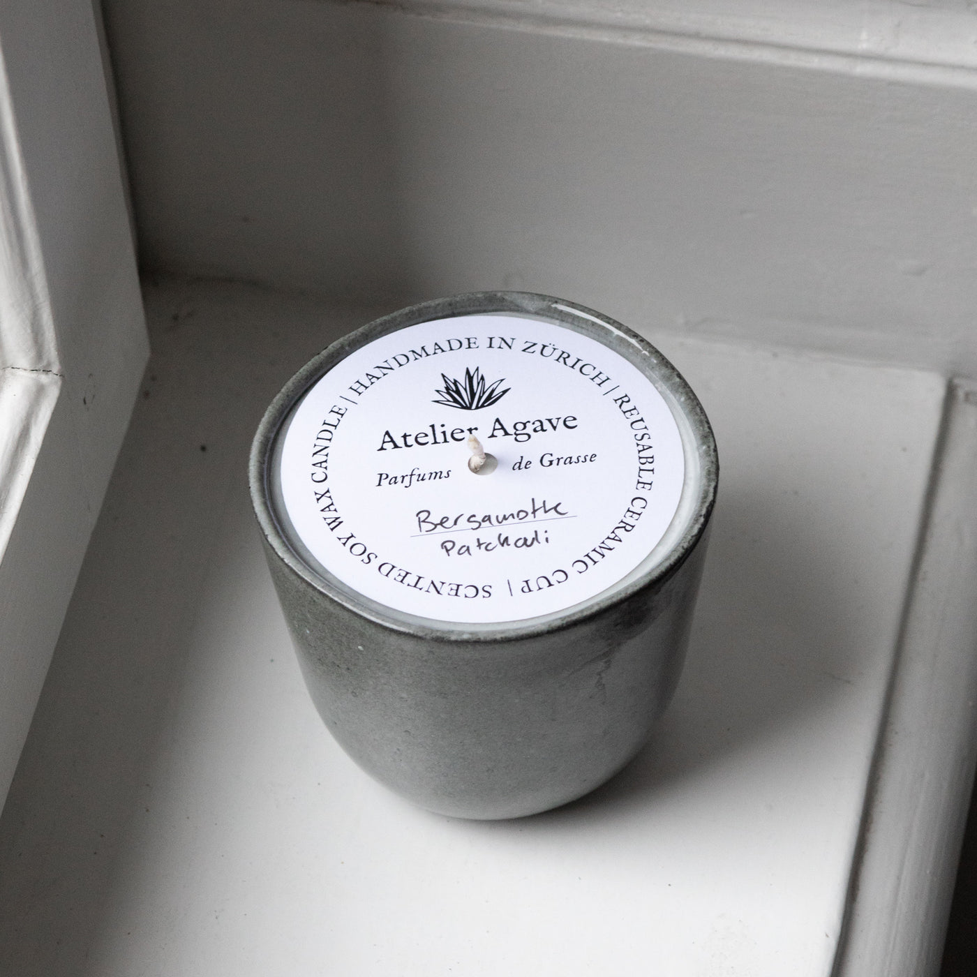 Scented candle bergamot patchouli in a cappuccino cup