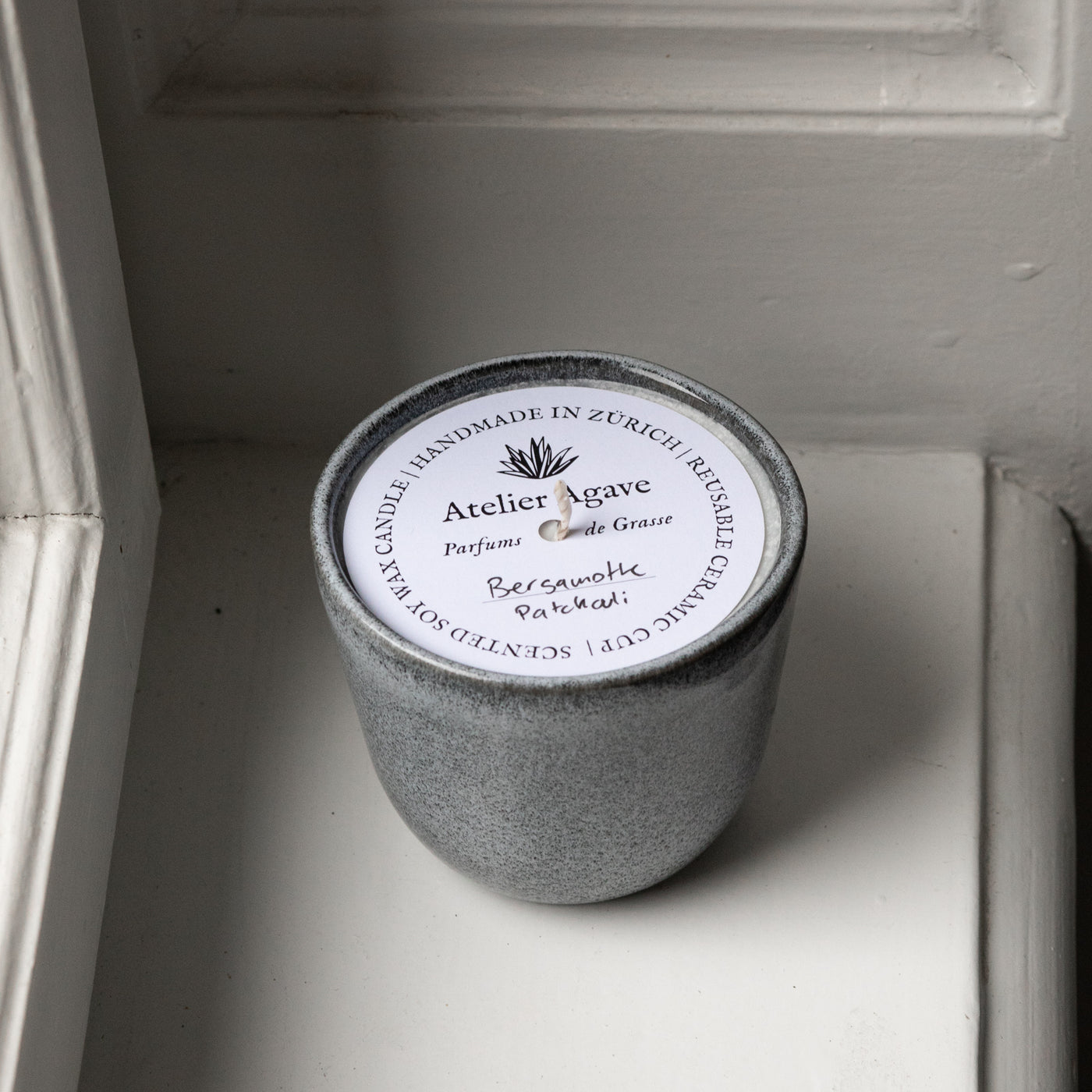 Scented candle bergamot patchouli in a cappuccino cup