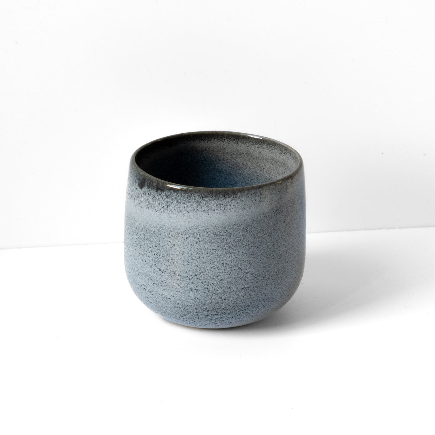 Blue Sand latte coffee mug made of stoneware with 280ml against a white background.