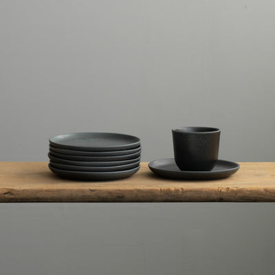 The matt black bread plate is ideal as a coaster for coffee cups