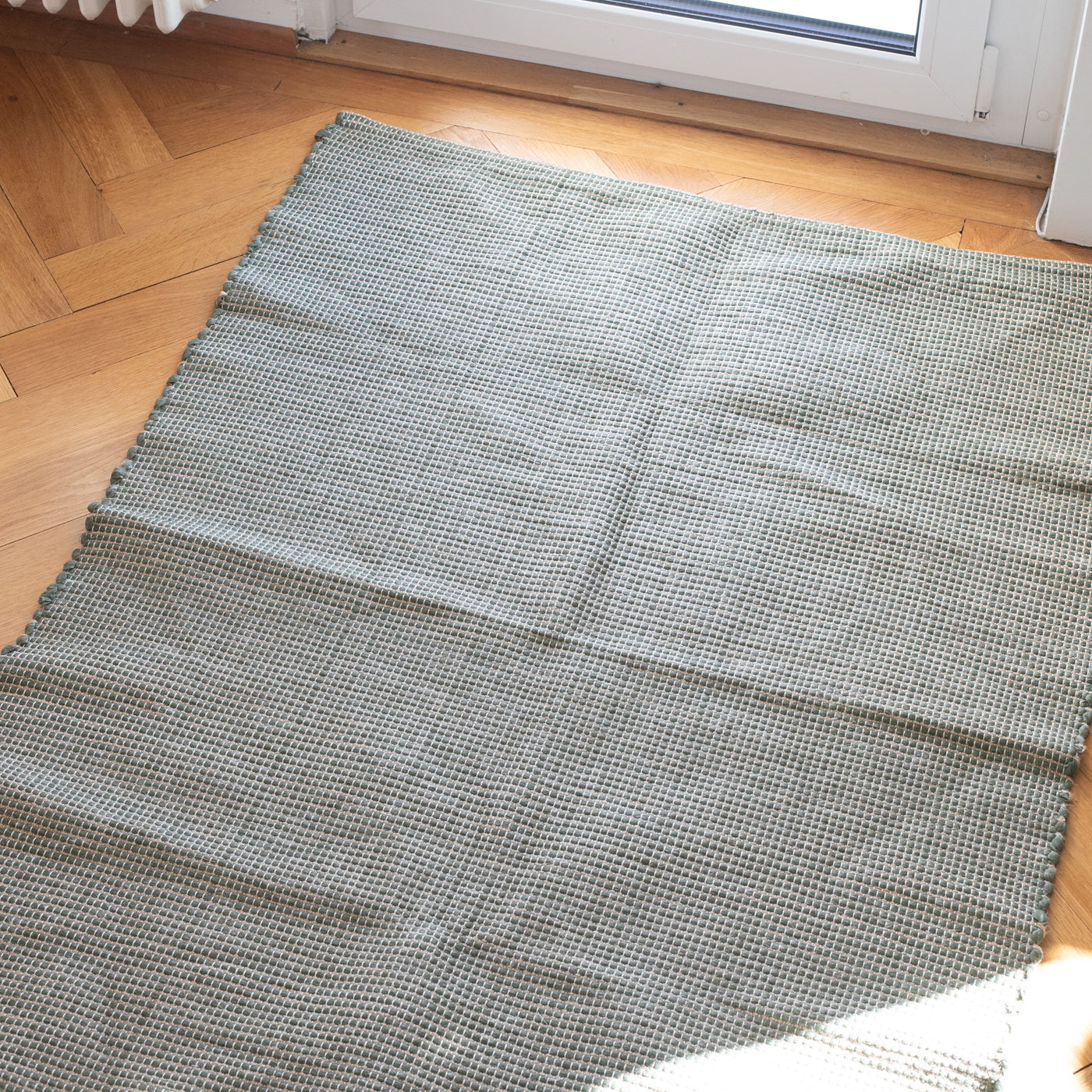 Yan – Farbiger Jute Teppich in Grün (100x160cm)