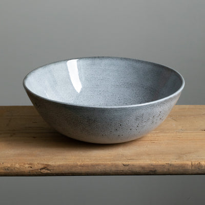 Blue salad bowl with slightly mottled glaze and large capacity