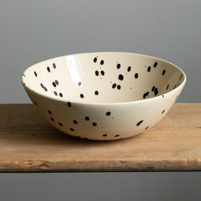 Large bowl suitable for salad or dough in the color cream with black splashes of color