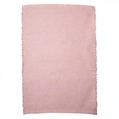 Petit tapis rayé de jute vieux rose en restes de laine tissé à la main au Portugal devant blanc libre