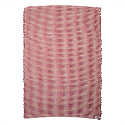 Petit tapis rouge à rayures de jute en laine tissée à la main au Portugal, avec des motifs blancs.