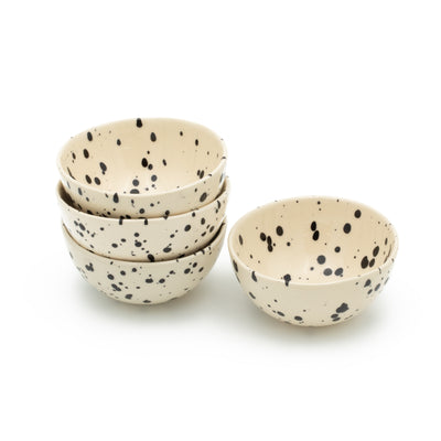 Four small snack bowls stacked on top of each other in Black Dots on a white background