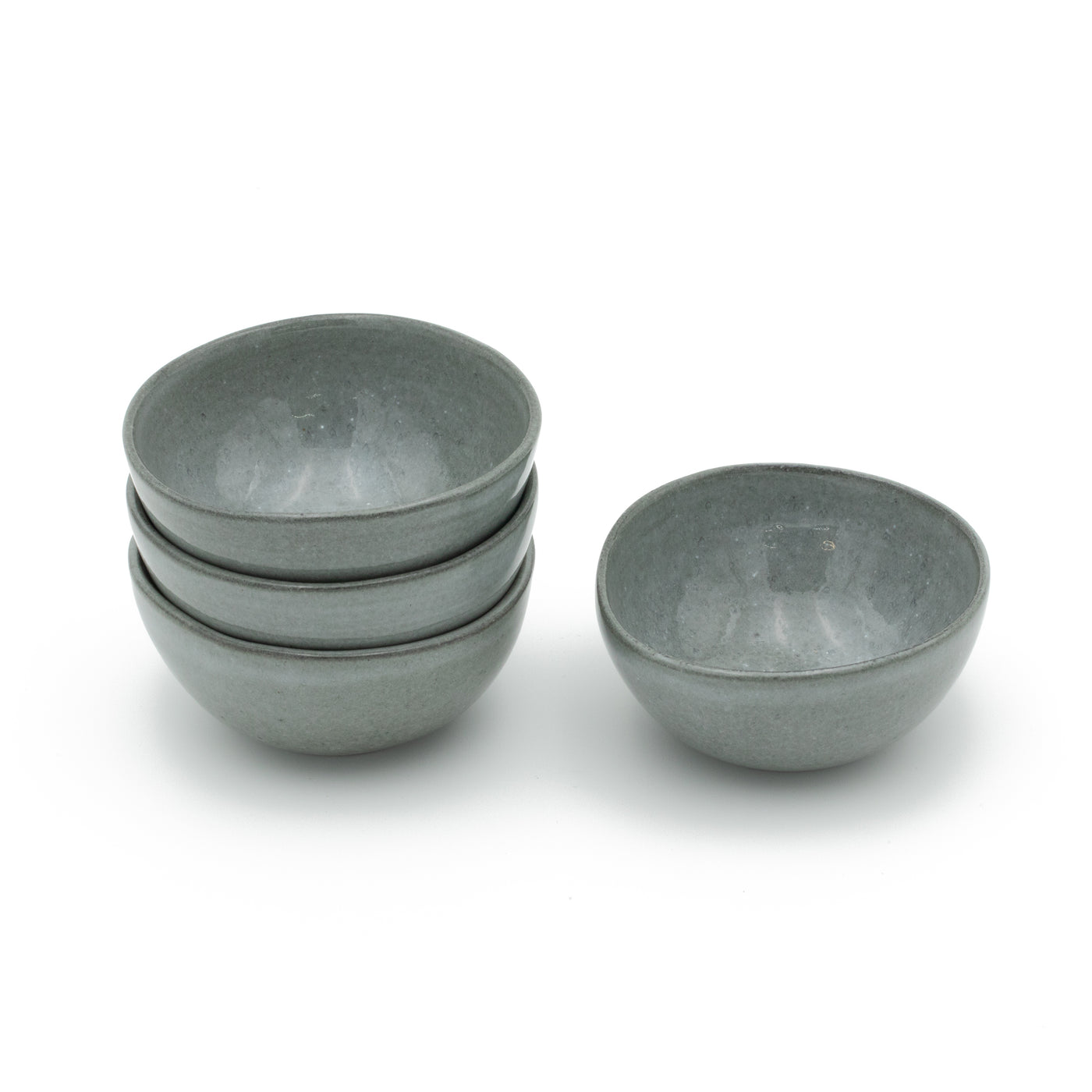 Stackable dark gray small snack bowls with a glaze reminiscent of the stormy sea
