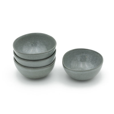 Stackable dark gray small snack bowls with a glaze reminiscent of the stormy sea